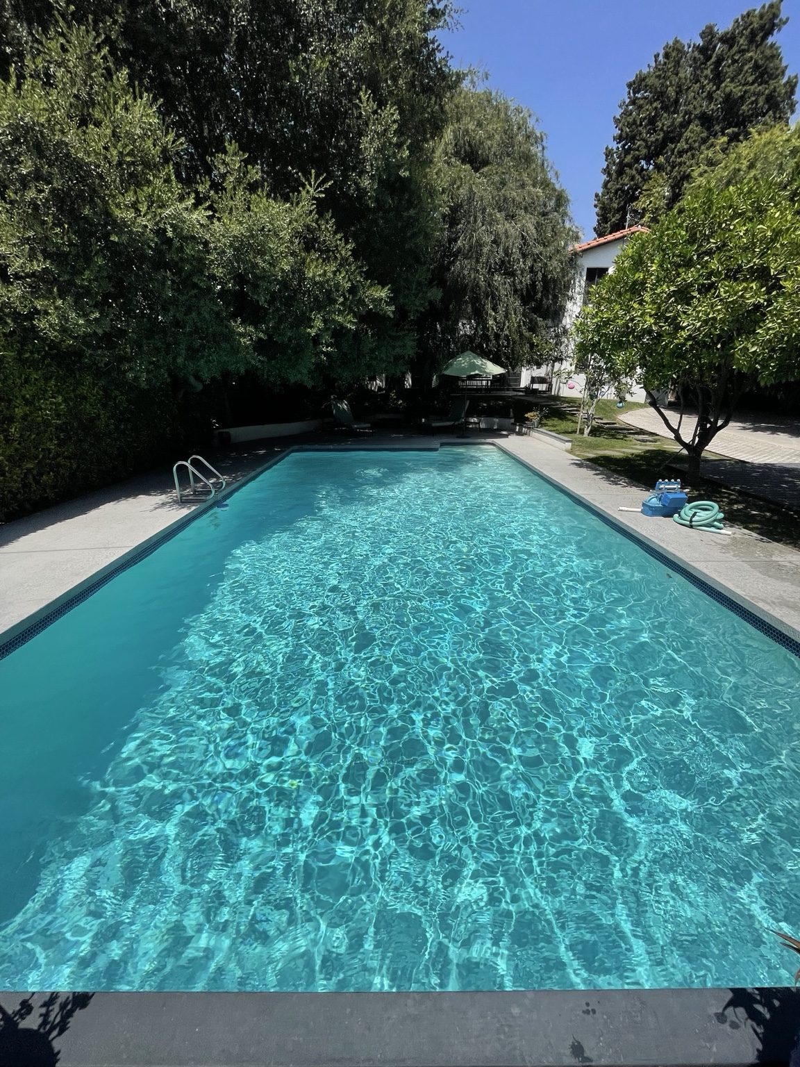 Real rectangular pool with bright sparkling blue water